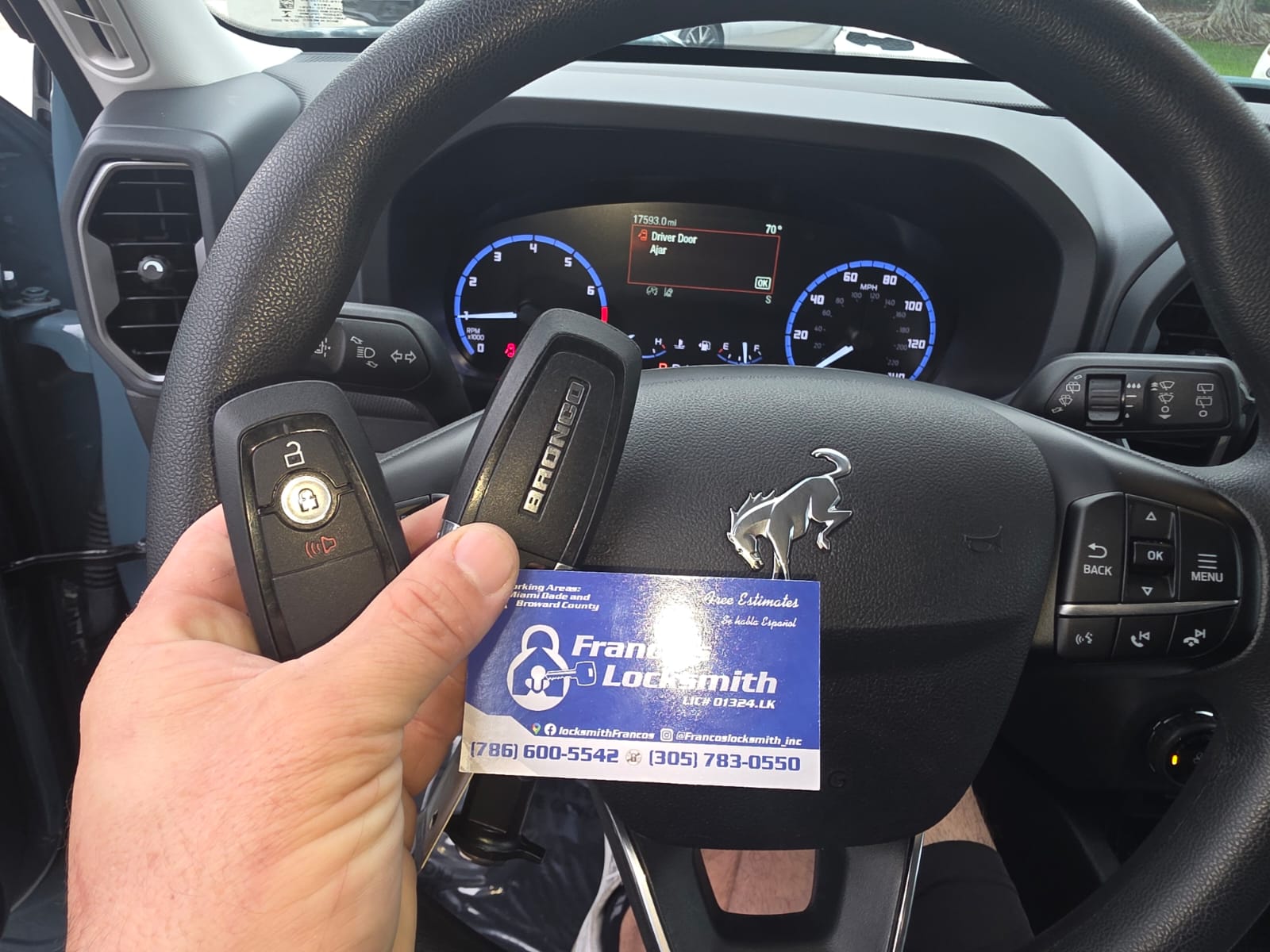Two smart keys shown inside a Ford Bronco Sport