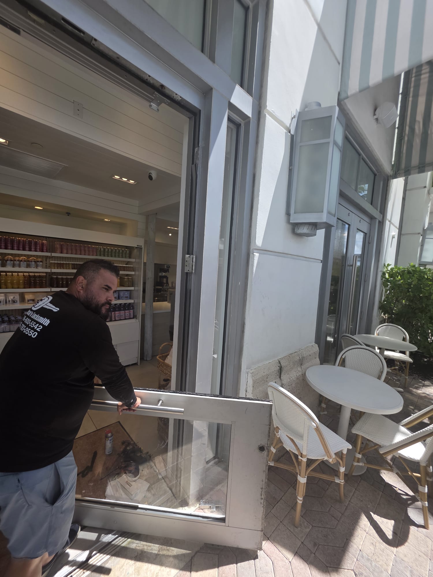 Franco working on a glass commercial entrance door